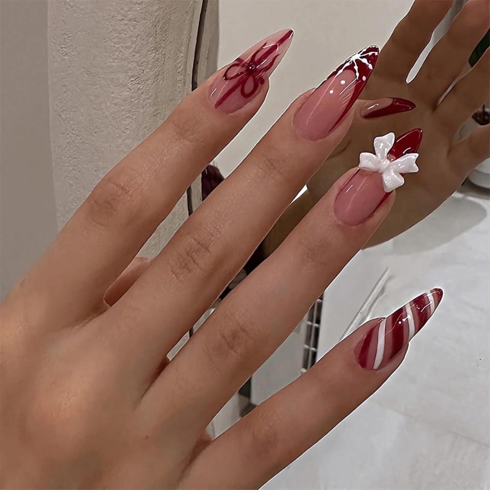 imageBABALAL Red Press on Fake Nails French Tip Design Acrylic Nails Medium Almond Shape Snowflake Candy Cane with Bow Charm Christmas Glossy 24pcs Reusable False Nails With Glue