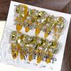 imageBABALAL Gold Press on Nails Long Stiletto Fake Nails Luxury Rhinestone Bow Charm Design Handmade Custom 10Pcs Nail Tip Bling Shiny Acrylic False NailsBNCU100